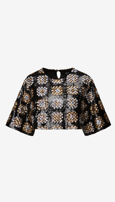 Black and gold patterned blouse on a white background