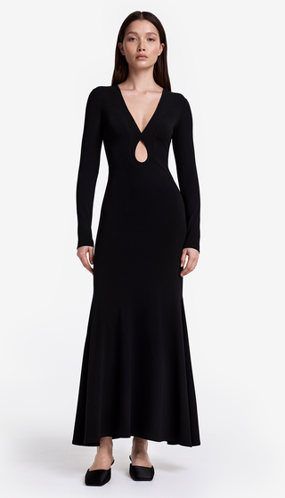 Black long-sleeve dress with cut-out design on a white background