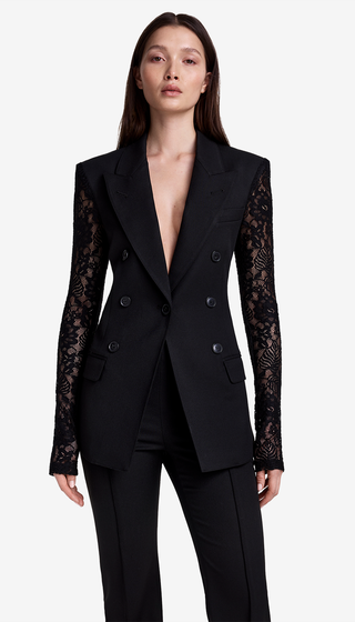 Black suit with lace sleeves on a white background