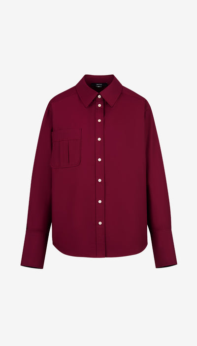 Maroon shirt with white buttons on a white background