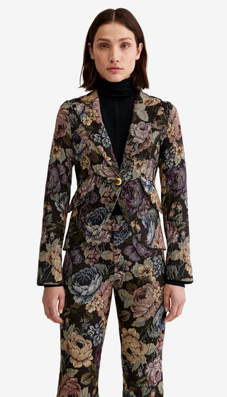 Woman wearing a floral suit on a white background