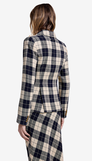 Woman wearing a plaid suit on a white background