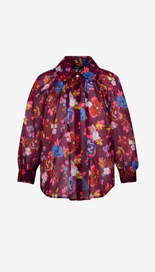 Floral patterned blouse on a white background