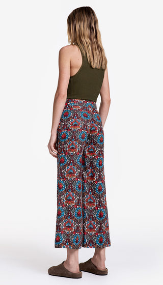 Woman wearing a patterned skirt on a white background