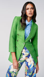 Woman in a green blazer