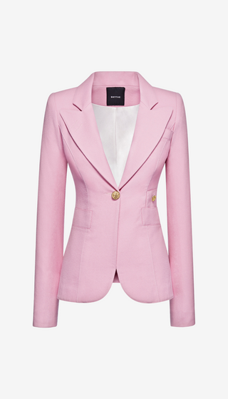 Pink blazer with a brand label on a white background