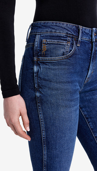 Close-up of blue jeans with a white background