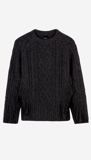 A dark charcoal gray cable-knit sweater with textured fringe details on the sleeves, displayed against a solid off-white background.