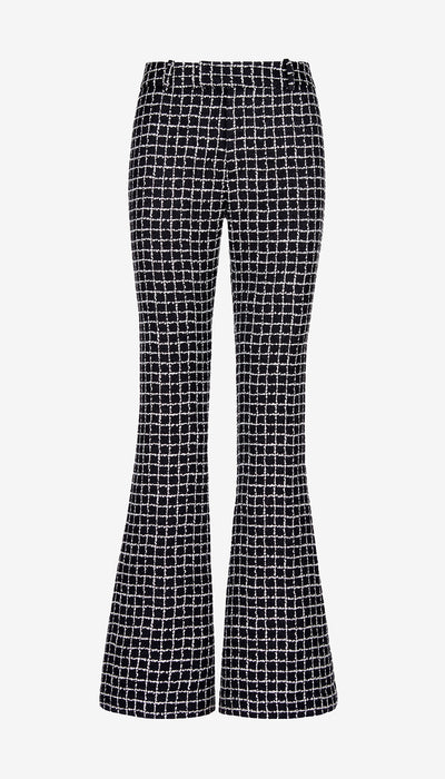 Black and white checkered flared pants on a light gray background