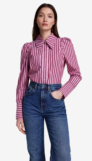 Woman wearing a pink and white striped shirt with blue jeans on a white background
