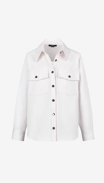 White denim shirt with black buttons on a white background
