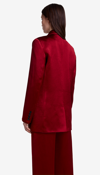 Person wearing a red suit on a white background