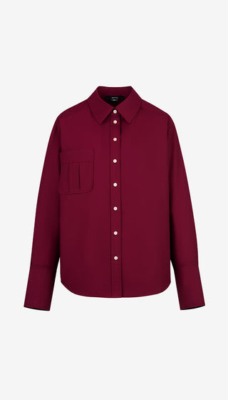 Maroon shirt with white buttons on a white background