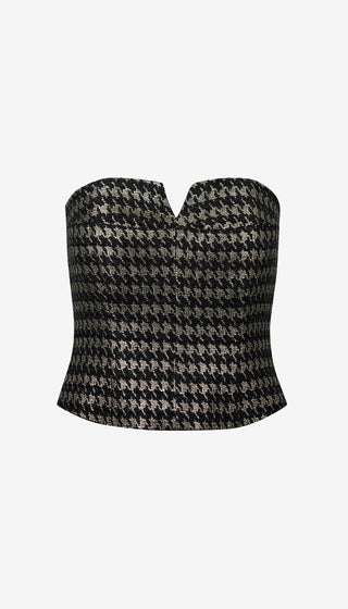 Houndstooth patterned top on a white background