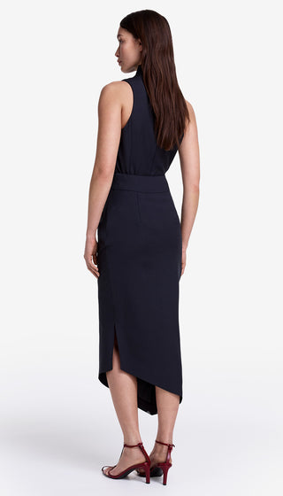 Woman wearing a black sleeveless dress on a white background