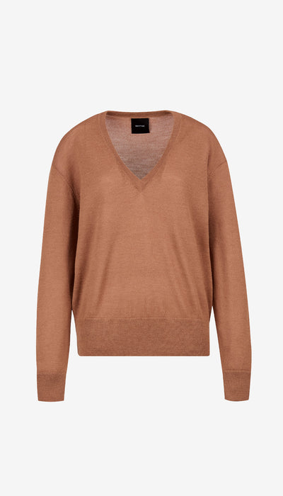 Brown sweater on a light beige background