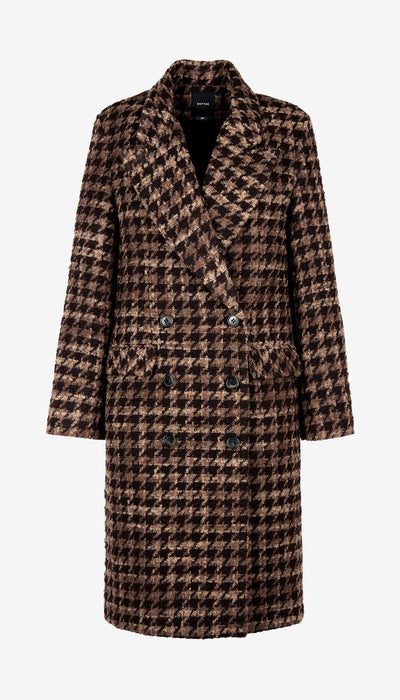 Houndstooth patterned coat on a white background