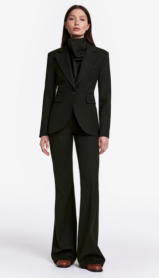 Person wearing a black suit on a white background