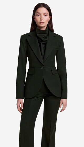 Woman wearing a black suit on a white background