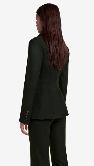 Person wearing a black suit on a white background