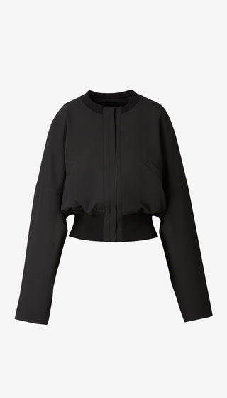 A black long-sleeve cropped jacket with a front zipper and ribbed collar, cuffs, and hem, displayed on a light gray background.