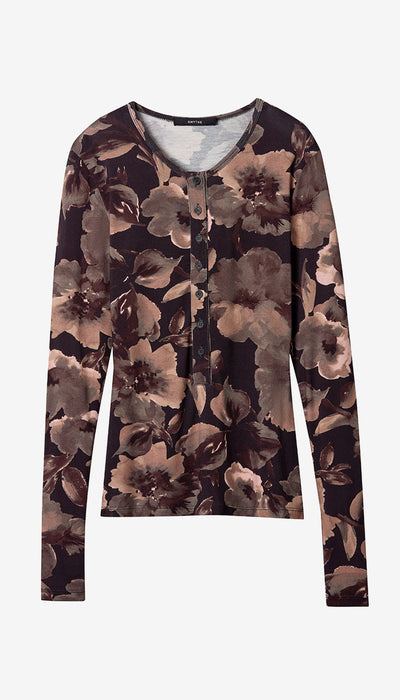 A long-sleeve button-front top with an abstract floral pattern in shades of brown, beige, and gray on a dark background, shown flat against a light gray background.