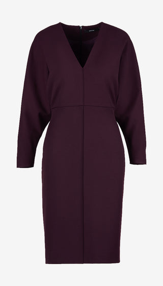 A dark plum purple long-sleeve V-neck dress with a wrap-style front closure, shown on a plain light gray background.