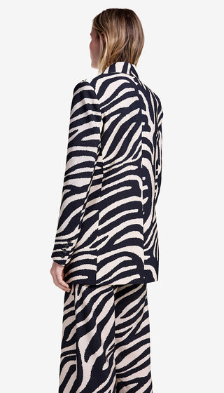 Person wearing a zebra print outfit on a white background