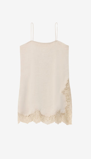 Beige lace-trimmed dress hanging against a white background