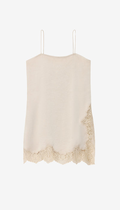 Beige lace-trimmed dress hanging against a white background