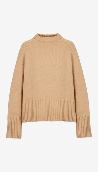 Beige sweater on a white background