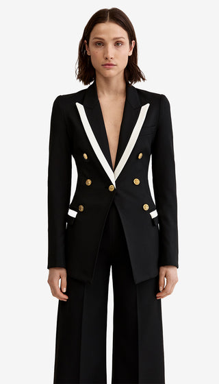 Black suit with white lapels and gold buttons on a white background