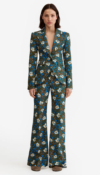 Floral patterned suit worn by a model on a white background