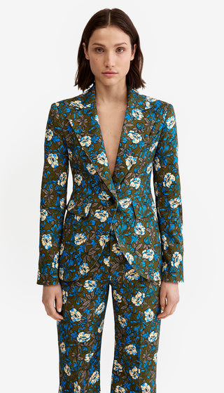 Woman wearing a floral suit with a white background