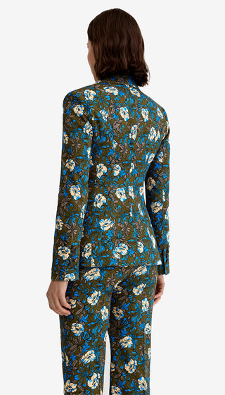 Person wearing a floral patterned suit on a white background