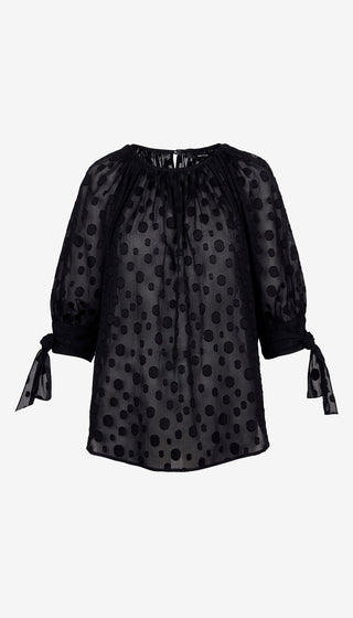 Black polka dot blouse with tied sleeves on a white background