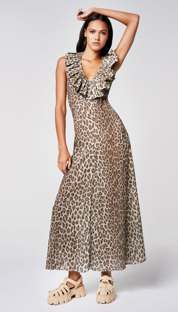 A woman in a leopard print dress