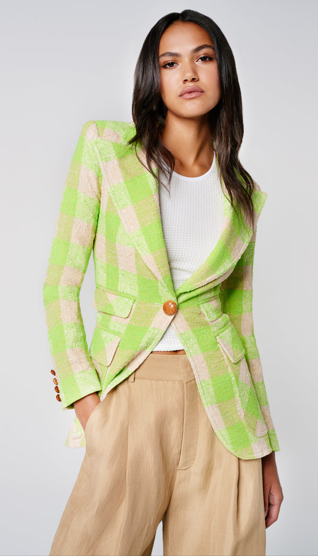 Woman wearing lime check blazer