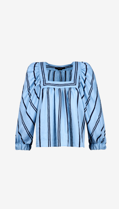 Light blue blouse with long sleeves on a white background