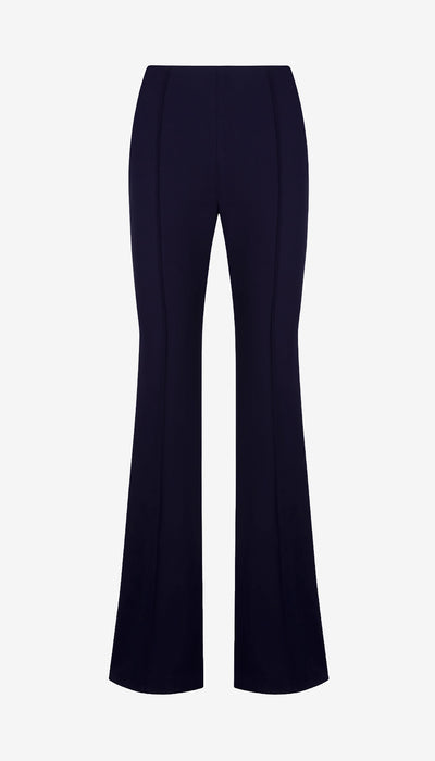 Navy blue flared pants on a light gray background
