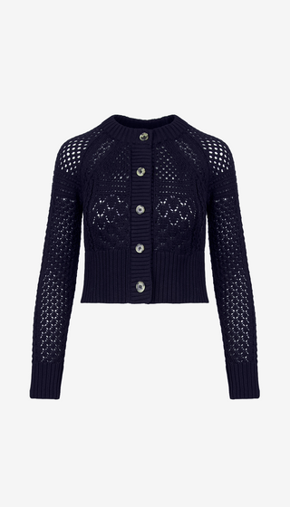 Navy blue knit cardigan with button details on a white background