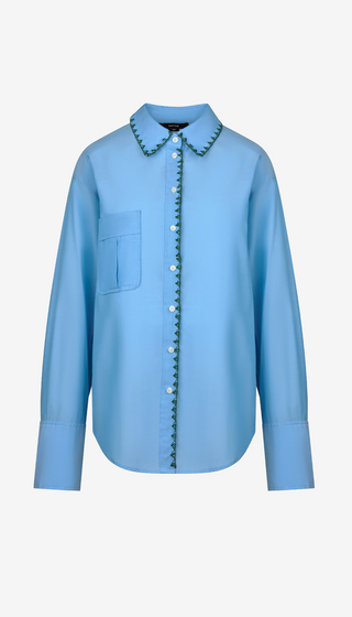 Blue shirt with decorative collar on a white background